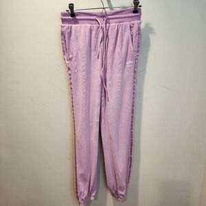 Adidas  pink jogger pants, featuring a soft material, a drawcord elastic Band S